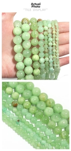 Macro view of assorted natural green Afghan jade round beads in various sizes for DIY jewelry