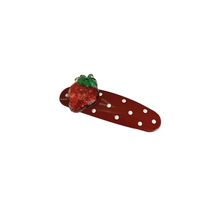 Sweet strawberry hair clip with red polka dots and glitter finish on white background