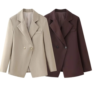 Flat lay of slim fit double-breasted blazers in beige and brown with lapel collar
