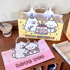 Chic cartoon dog gift bags in yellow and pink set on a cozy wooden cafe table