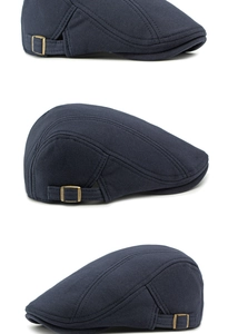 Detail view of cotton knitted beret with brass adjustment buckle in navy blue