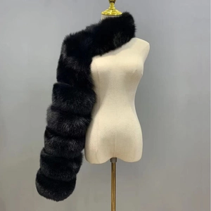 Detail of black faux fox fur shawl with horizontal layered stitching on mannequin