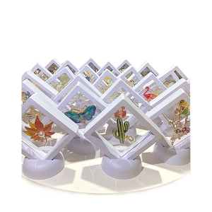 3D floating jewelry display boxes with pearl brooches and enamel butterfly pins