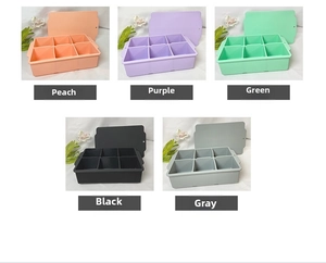Detail view of 6-compartment silicone ice cube trays with lids in five assorted colors