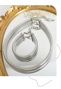 Detailed macro view of silver snake bone chain set with K18 engraving and mirror finish