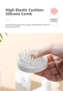 Detail of high-elasticity air cushion and silicone bristles on white scalp massager