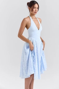 Detail of light blue halter V-neck midi dress with intricate floral jacquard fabric