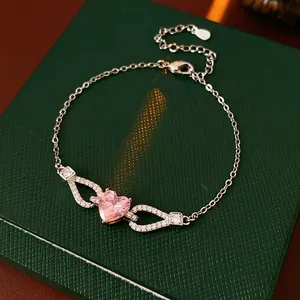 Elegant silver bracelet with a large sparkling pink heart zircon and diamond accents