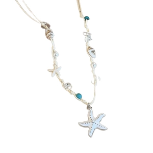 Handmade beach necklace featuring large white starfish pendant with turquoise beads and shells