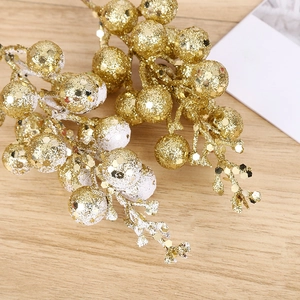 Golden artificial berries branch with glitter and snow frost for Christmas tree decoration