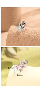 Detail of star-shaped titanium steel screw-back earrings with blue and pink zircon