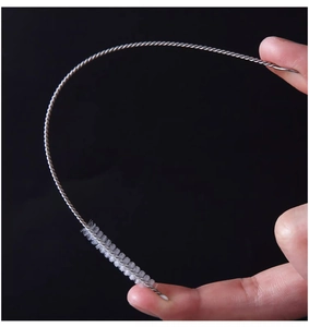 Close-up of flexible stainless steel wire handle and soft nylon bristles straw brush