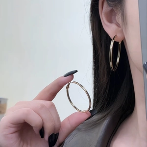 14k gold-plated large hollow hoop earrings with modern black enamel contrast design