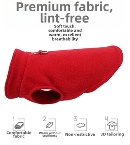 Detail of red fleece pet vest showing D-ring for leash and lint-free fabric texture