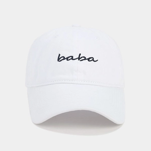 Detailed view of white cotton baseball cap with black embroidered 'baba' text on front