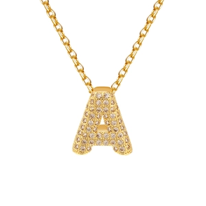 Luxury gold plated letter A pendant necklace with sparkling zircon crystals on white background