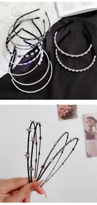 Detail of elegant metal headbands featuring sparkling rhinestones and delicate pearls