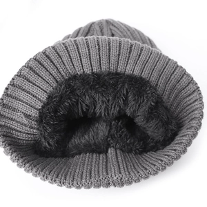 Winter knit beanie with warm black fleece lining and grey textured exterior for men