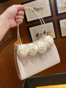 Elegant ivory satin evening handbag with 3D rose flowers and double pearl handles