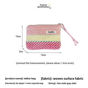 Detailed view showing the 16x10x2cm dimensions of the colorful striped woven pouch