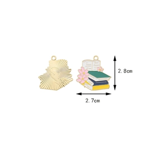 Detailed view of book and flower metal charms with colorful enamel finish and size data
