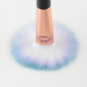 Fan-shaped makeup brush with blue-purple gradient bristles and rose gold ferrule