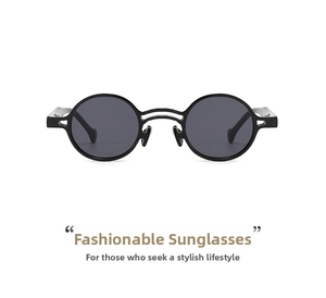 Detail of vintage round sunglasses with black frames and unique double bridge design