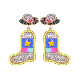 Detail of beaded cowboy boot and hat earrings with sparkling rhinestones and enamel