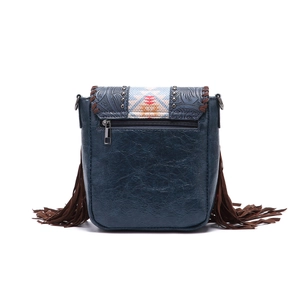 Macro view of blue vintage crossbody bag featuring leather fringe and rear zipper pocket