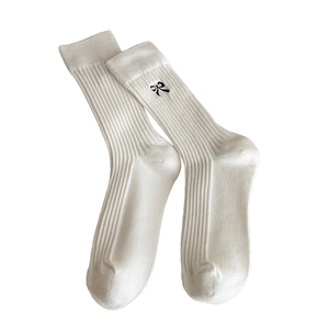 White cotton crew socks with vertical stripes and black embroidered bow detail for women
