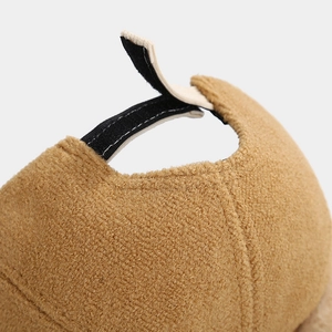 Detail of brown faux shearling toddler baseball cap featuring adjustable velcro strap