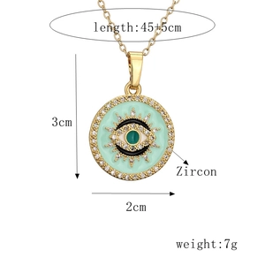 Detail view of mint green enamel evil eye necklace with zircon and size measurements