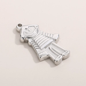 Macro shot of silver stainless steel girl pendant with polished finish and metal bail