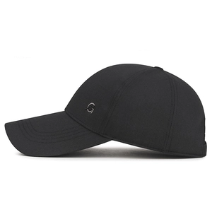 Classic black baseball cap with extended brim and small metal logo for sun protection