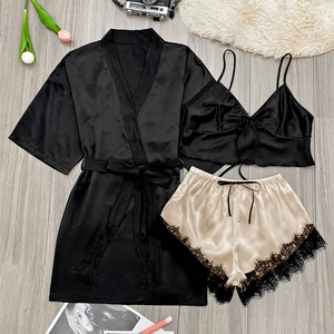 Three-piece satin sleepwear set featuring black silk-like robe with champagne lace shorts