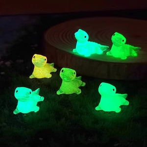 Luminous resin dinosaur miniatures set for DIY gardening featuring a glowing green effect