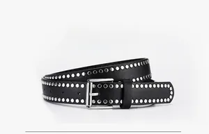 Detail of black PU leather belt featuring double-row silver rivets and rectangle buckle