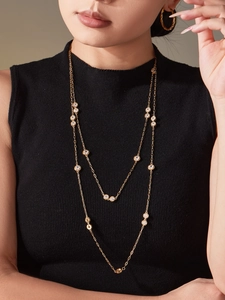 Double-layer gold 18k necklace with brilliant 5A cubic zirconia on a black sweater