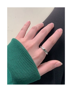 Detailed view of an S925 silver ring featuring three delicate green zircon gemstones