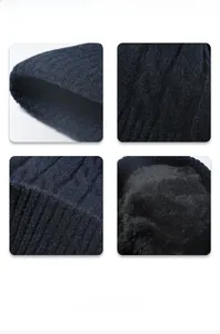 Detail view of dark blue cable knit pattern and thick black fleece lining for warmth