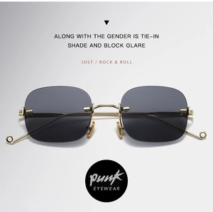 Detail of rimless square sunglasses with dark grey gradient lenses and gold metal temples