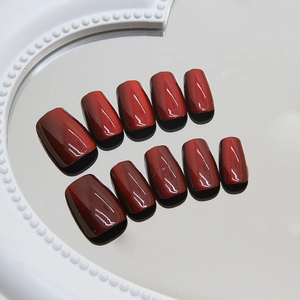 Handmade cherry red cat eye press-on nails with shiny finish and square round shape