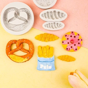 Silicone food molds for DIY baking showing pretzel, croissant and donut shapes