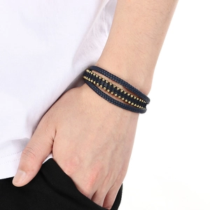 Men's multilayer navy braided leather bracelet with gold beads on model wrist