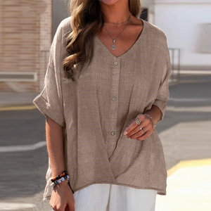 Detail of khaki cotton linen shirt featuring V-neckline and stylish front knot design
