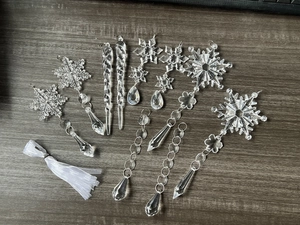 Macro view of clear acrylic snowflake and icicle ornaments for festive decoration