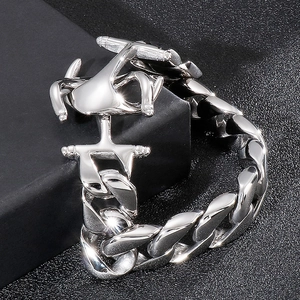 Detail shot of heavy silver Cuban link bracelet featuring a unique anchor-shaped buckle