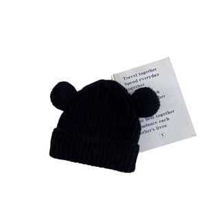 Winter knit beanie for kids featuring cute bear ears and thick ribbed texture in black