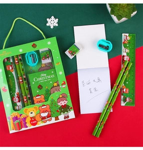 6-piece Christmas stationery set featuring pencils, ruler, eraser and notepad in a green gift box