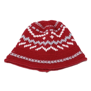 Detail of red Fair Isle knit cloche hat with white and gray geometric wave patterns